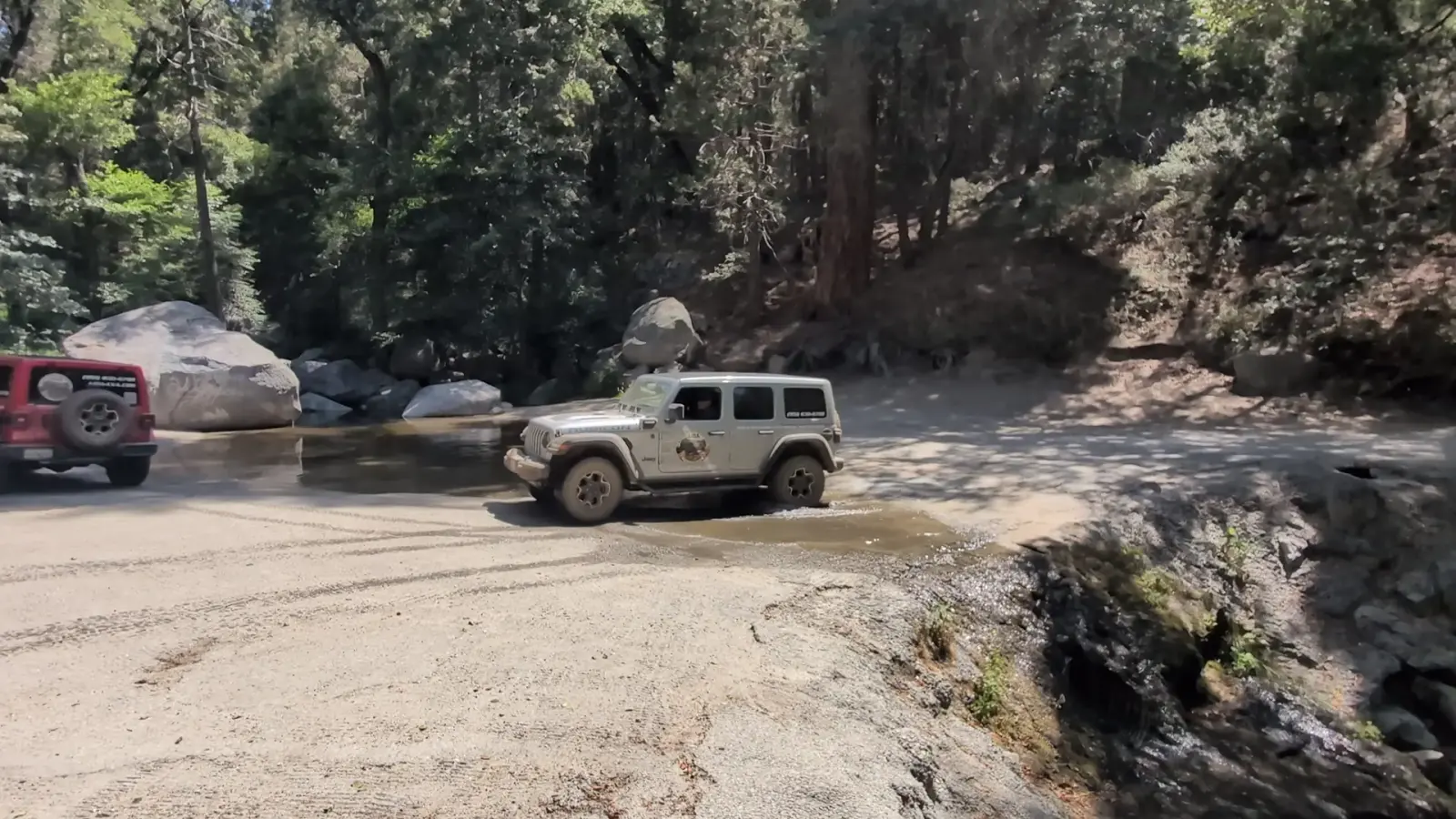 Silver AIOA Rubicon fording the San Jacinto Creek crossing with the red Jeep following