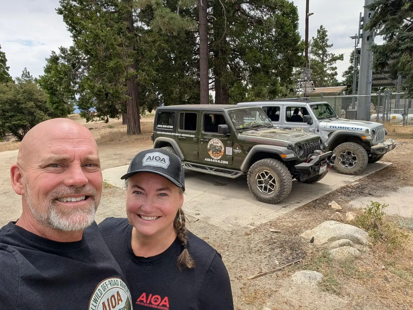 AIOA guides and guests at the Thomas Mountain summit among the pines